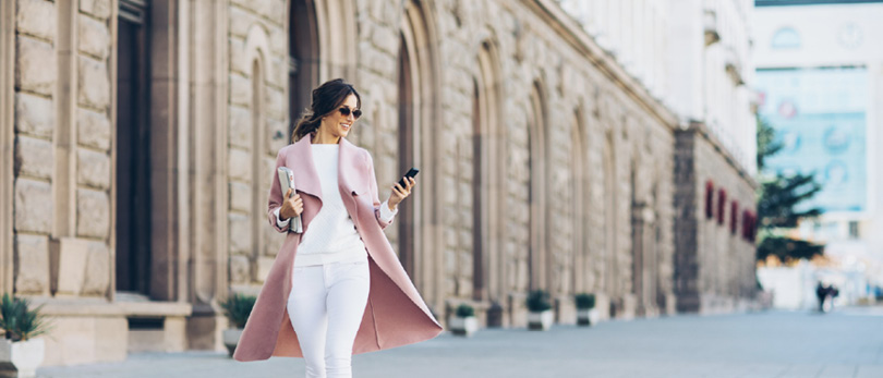 fashionable woman walking down the street