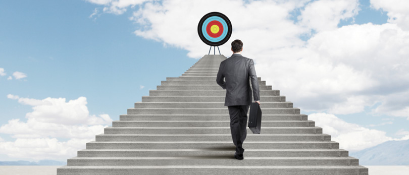 man walking up stairs to reach target