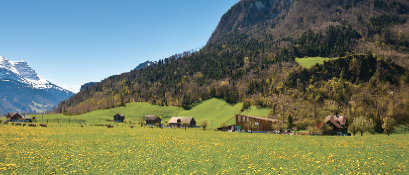 prairie with home in distance