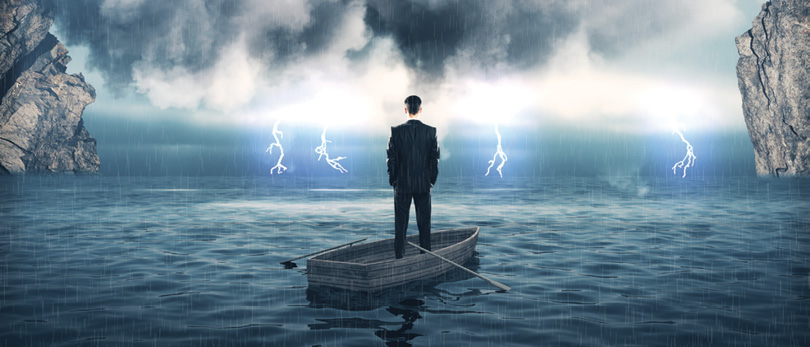 man in boat facing storm