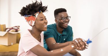 two people painting