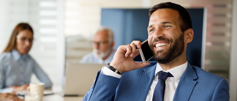 man talking on cell phone smiling