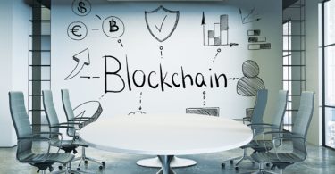 blockchain written on boardroom wall