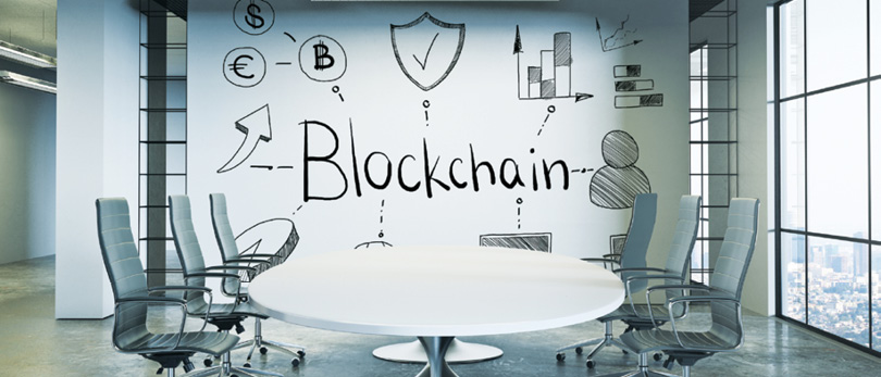 blockchain written on boardroom wall