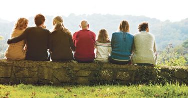 multiple aged family members sitting together