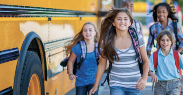 kids getting off school bus