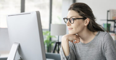 woman looking at computer