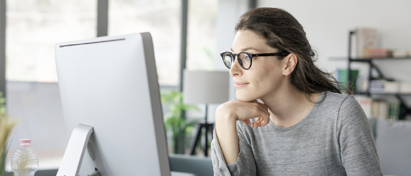 woman looking at computer