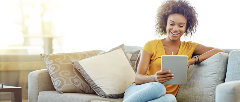 woman looking at content on tablet