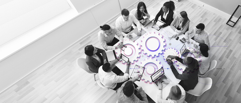 people sitting around a cog-based table