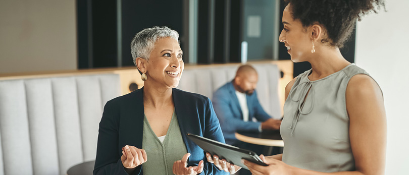 older woman mentoring a younger woman