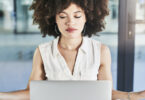 woman practicing mindfulness in front of computer