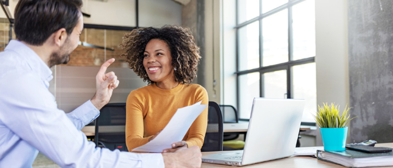 man and woman discussing business