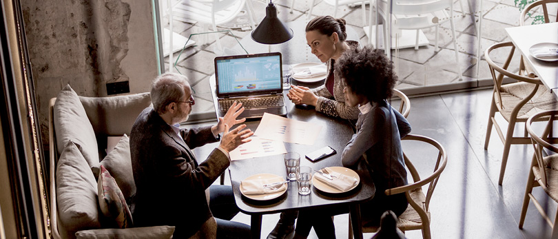 people negotiating at a business table