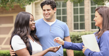 couple getting keys to a new home