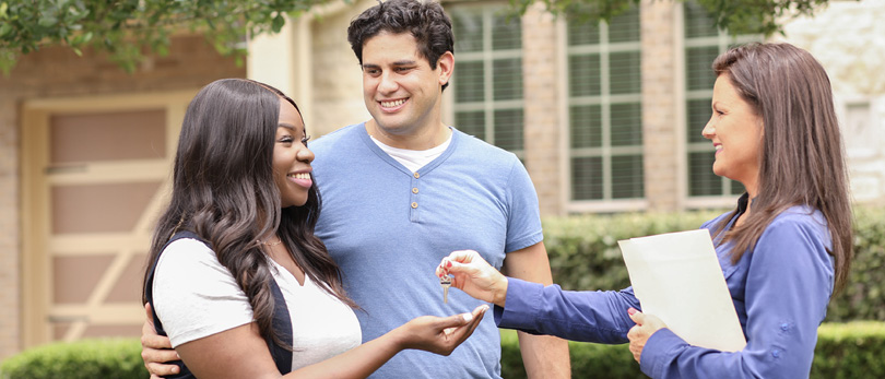 couple getting keys to a new home