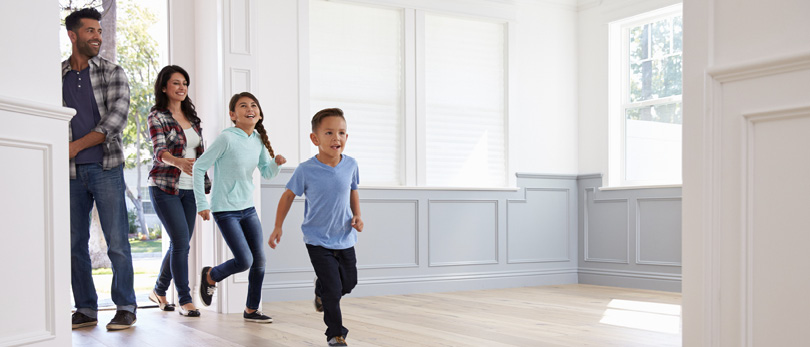 family running into a new home