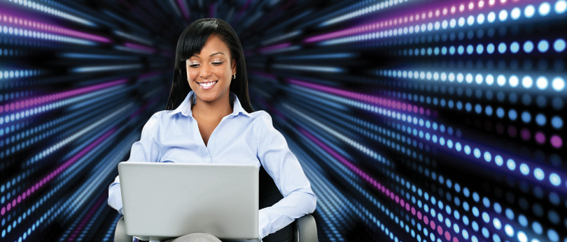 woman on computer with fast moving lights