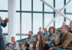 man presenting in front of audience