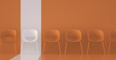 chairs with orange background with one highlighted white