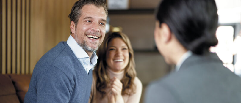 A couple meeting with a REALTOR